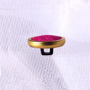 gold rim covered button